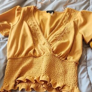 1. State Mustard Yellow Smocked Peplum Wrap Top